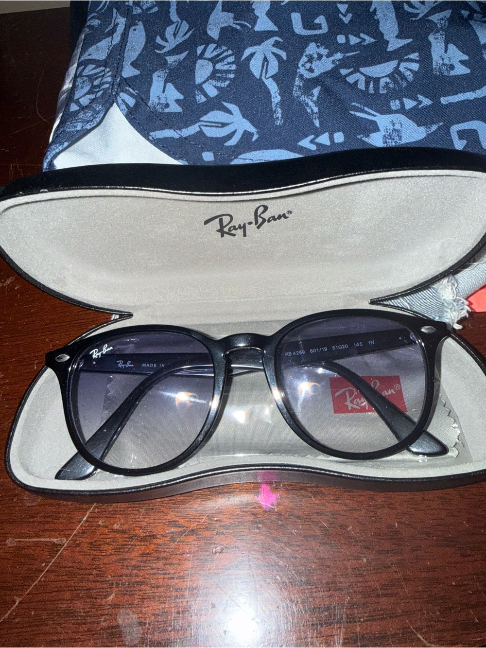 Ray-Ban Women’s Black Round Frame Sunglasses with Gray Gradient Lenses